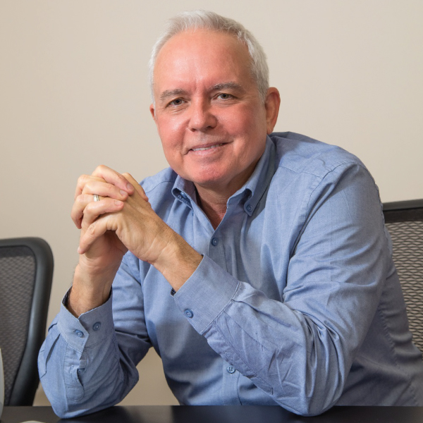 Our CEO, Rick Russell and our in-house 3D printer for medical ID  tags